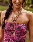 Model wearing assorted fox pendants