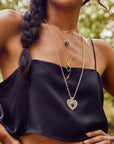 Gold layered pendants on model