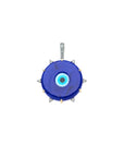 Blue glass evil eye disk pendant in gold setting accented with white topaz stones