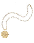 Eagle coin on drawn link chain