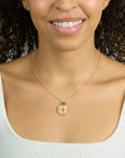 Model wearing the protect evil eye petite embellished pendant on the classic rolo chain