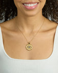 Model wearing the protect with an open eye pendant on the classic rolo chain
