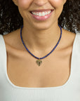Model wearing the protect eye on your heart beaded necklace