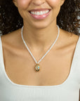 Model wearing the strong in the waves necklace