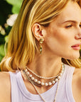 Model wearing the strong amore fish earrings