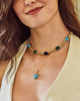 Model wearing the protect scarab curb chain and the protect guardian scarab pendant in turquoise