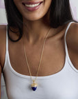 Model wearing the Hope acorn pendant on adjustable snake chain