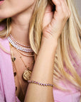 Model wearing the made from love pink tennis bracelet