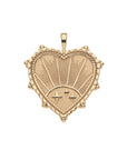 Gold heart pendant with sun illustration and star details