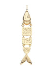 Back of gold fish pendant features the words "seize the day"