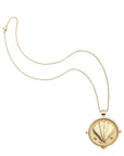Gold clamshell coin on classic rolo chain