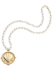 Gold clamshell coin on drawn link chain