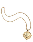 Gold clamshell coin on grande rolo chain