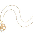Gold starfish cutout coin on the beaded satellite chain