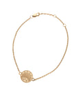 Gold delicate chain bracelet with small rising sun coin