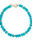 Beaded necklace features chunky turquoise beads with flat gold beads mixed in and oversized gold lobster clasp