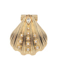 Gold clamshell pendant featuring white topaz accents