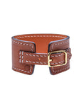 Back view of brown leather cuff bracelet shows adjustable buckle closure
