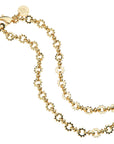 Gold link chain with sun shaped textured links