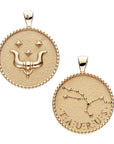 Gold original Taurus coin pendant with bull horns and star details on one side and Taurus constellation with "Taurus" written underneath on the other side