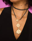 Model wearing lucky wish on star pendant