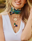 Model wearing assorted pendants