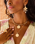 Model wearing gold dogwood flower ring