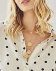 Gold Coin Necklaces Layered on Model