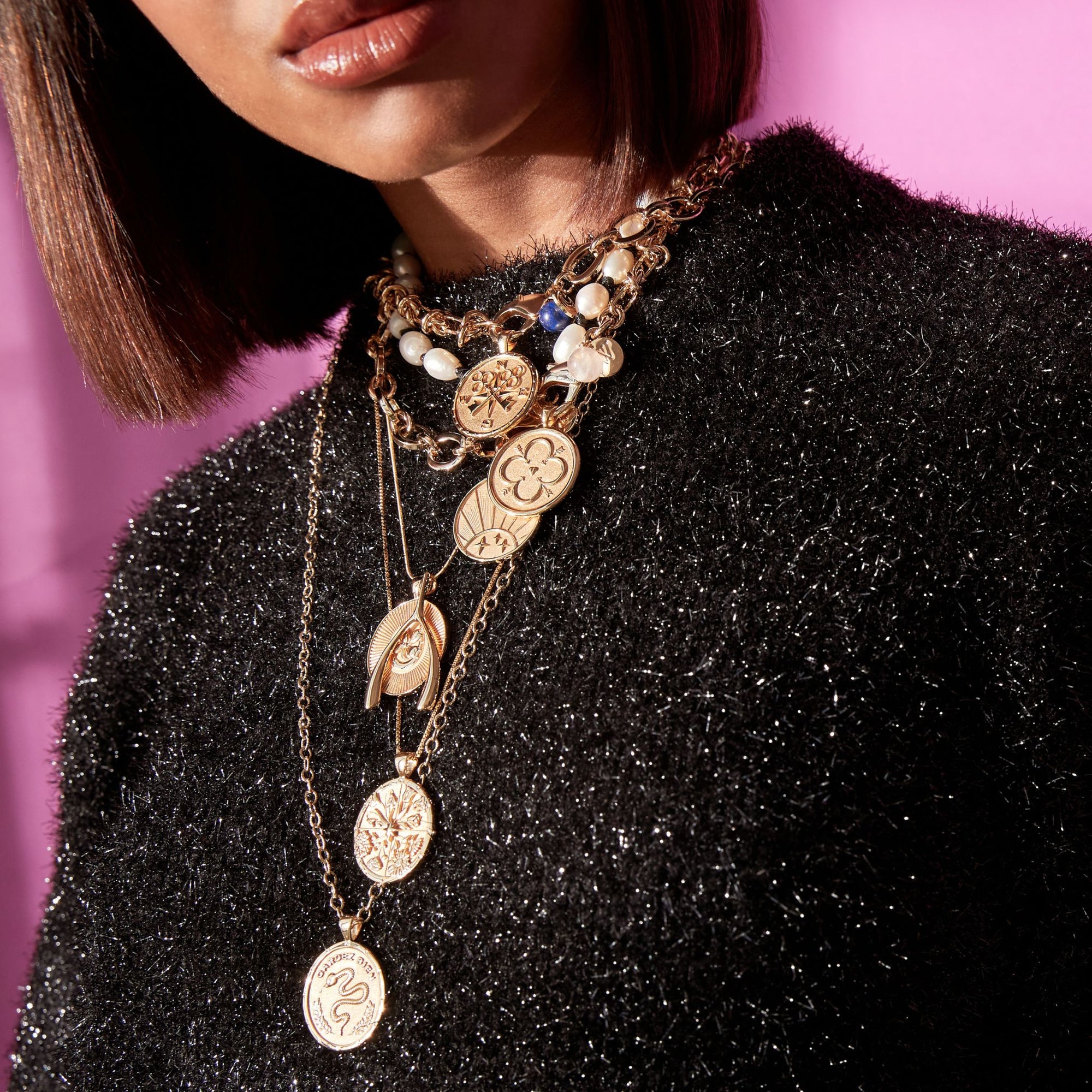Gold Necklaces Layered on Model