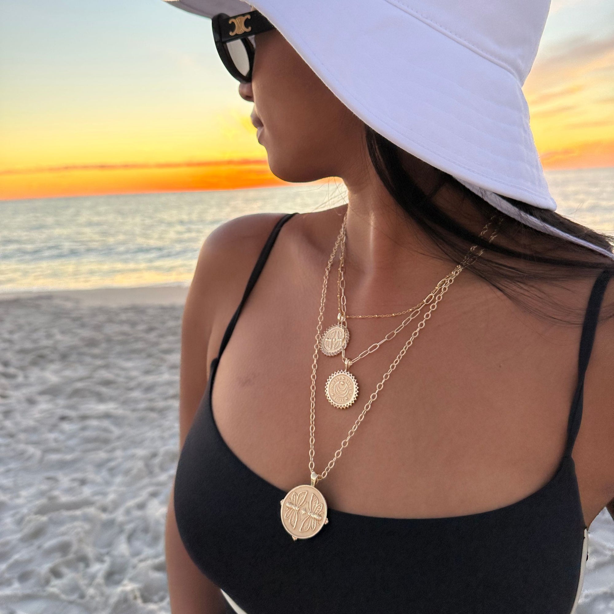 Gold Coin Necklaces Layered on Model