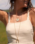 Gold Coin Necklaces Layered on Model