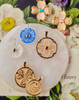 Gold Coin and Charms stylized and shot on book of flowers