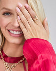 Model wearing gold coiled snake ring