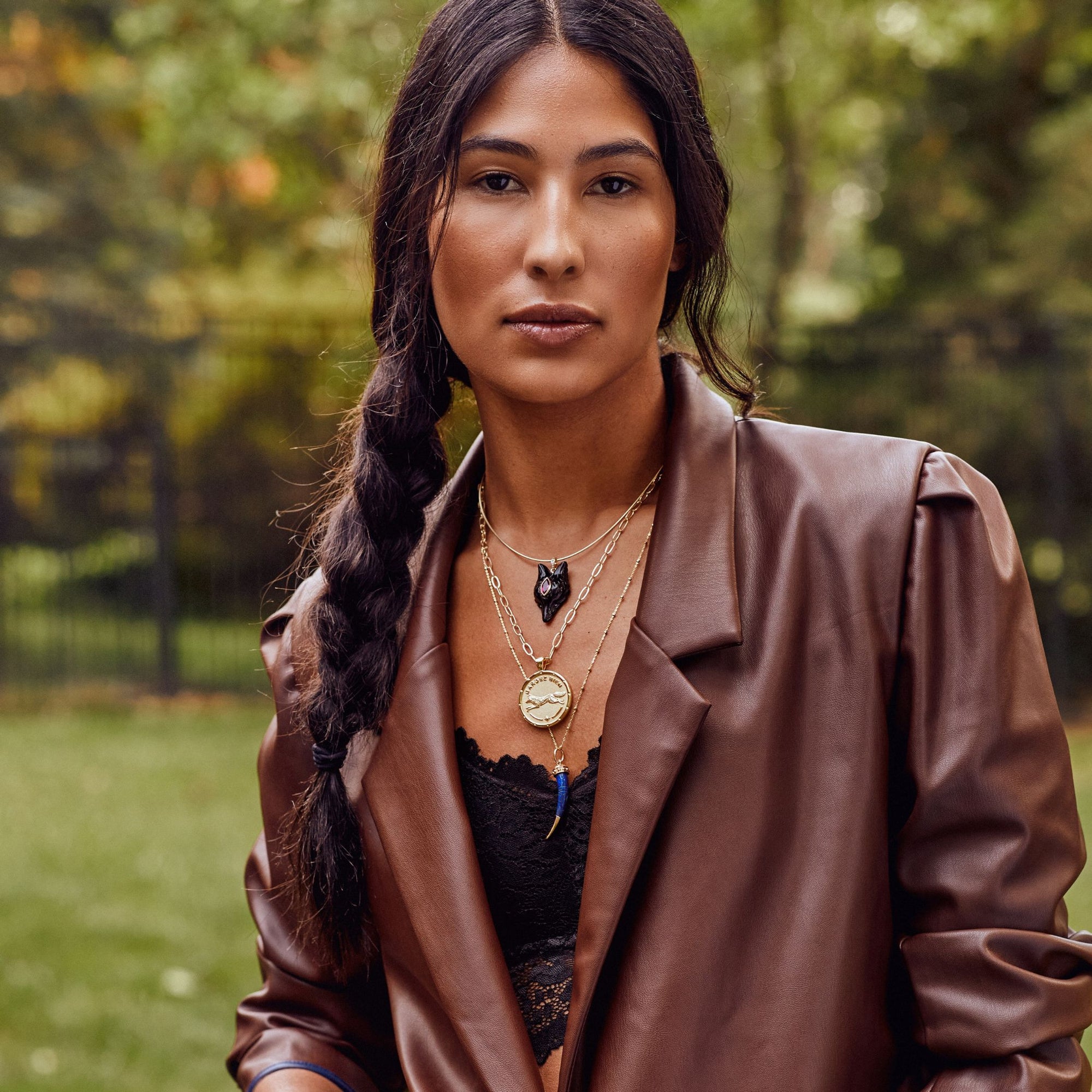 Model wearing various protect pendants