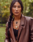 Model wearing various protect pendants