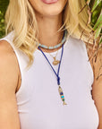 Model wearing fish pendants