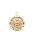 Back of gold coin pendant features moon and star logo and the word WANDERLUST