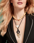 Model wearing different full heart pendant options