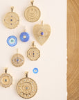Stylized image featuring assorted evil eye coins and pendants