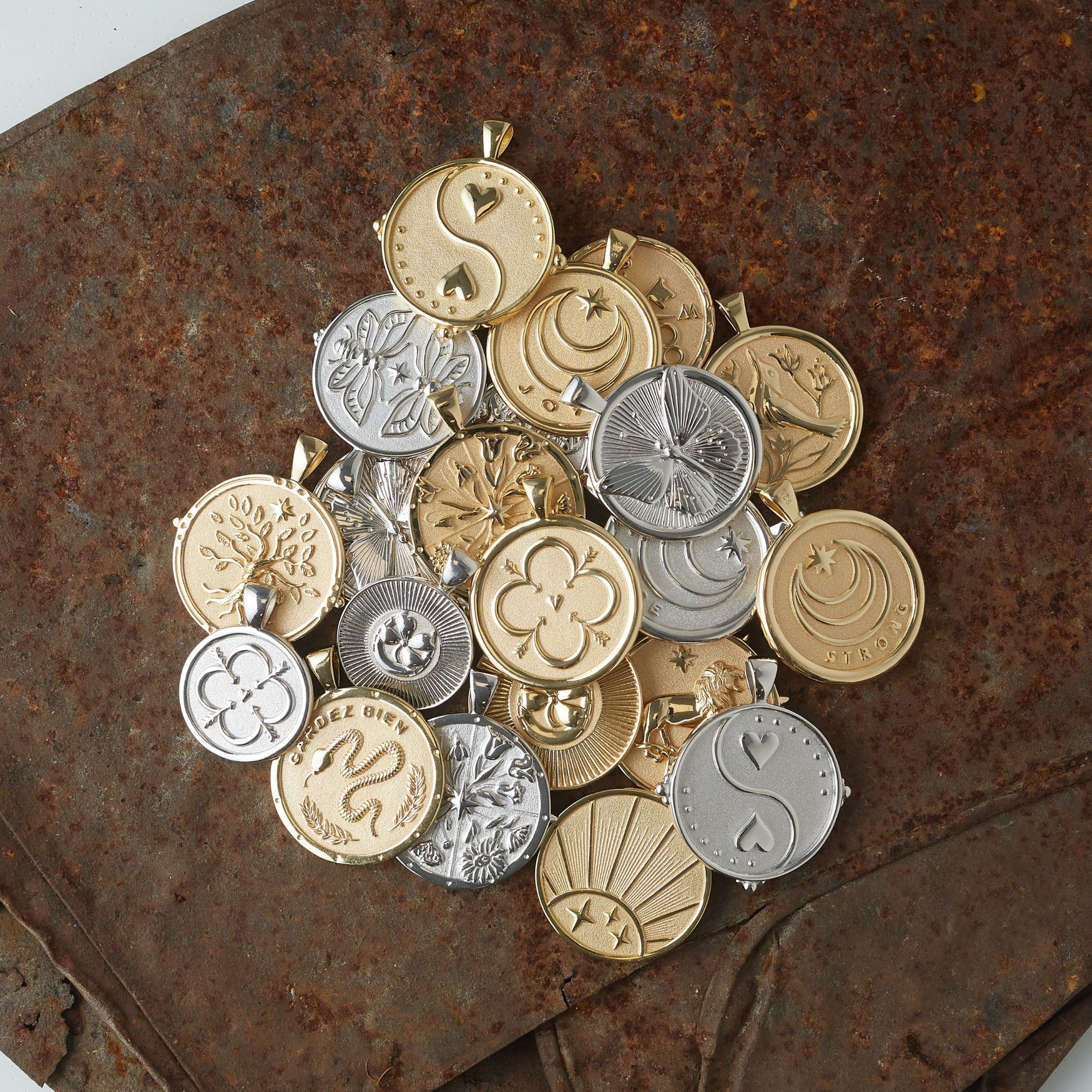 Syled pile of gold and silver coin pendants