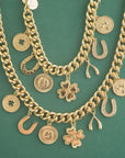 Stylized shot of lucky charm necklace and bracelet on green background