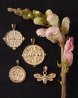 Stylized shot of pendants from the sisters collection with flower buds