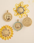 Stylized shot of assorted sun pendants with watercolor suns