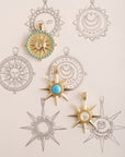 Stylized shot of supernova pendants and sun coin with sketches of various sun designs