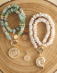 Stylized shot of inspiration pendants with chunky beaded necklaces