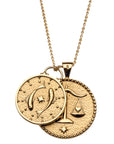 Gold original size Libra pendant and small Pisces pendant on a gold chain