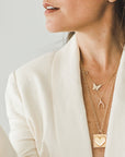 Gold layered necklaces on model