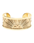 Gold cuff bracelet with rising sun design and star details