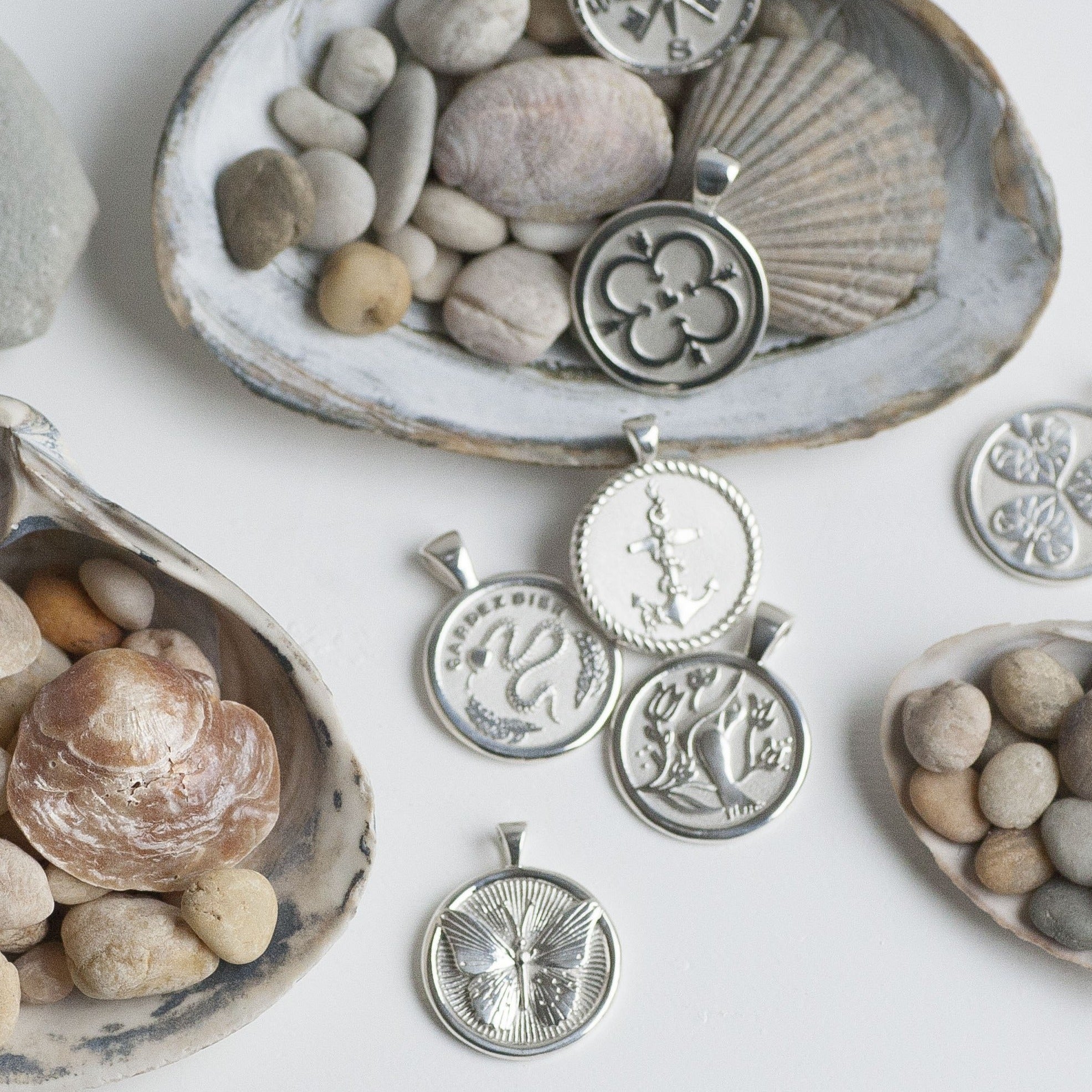 Stylized shot of silver coins with seashells