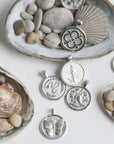 Stylized shot of silver coins with seashells